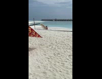 Guy beach selfie dirty water from tube