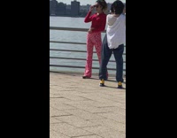 Woman red outfit sunglasses railings photo shoot Part 2