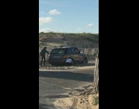Guys get car range rover stuck in sand try to get it out