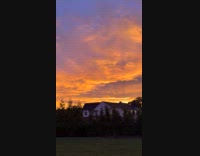 Sunset in sky filmed from the backyard