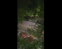 Guy walks drags blue toy airplane behind 