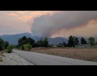 Large smoke come from mountain forest wildfire