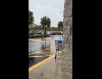 Man slips and falls running on puddle