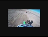 Green Motorcycle Jumps Dirt Ramp Falls Into Wire Fence