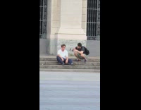 Guy sits on stairs takes side profile picture