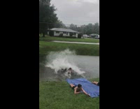 Man shirtless ran and slides on the ditch