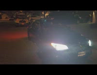 Black BMW Convertible car roof fold yard