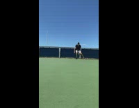 Guy does dribble tricks at  basketball court