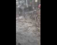 Submitter on bus shows knee deep flood on streets