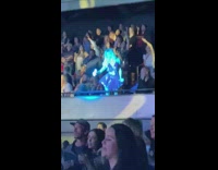 Blonde woman red dress dance concert