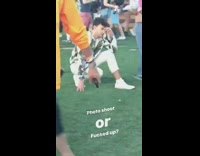 White pants guy squats poses grass coachella 