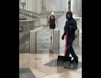 Guy wears tank top and shorts snow