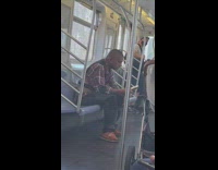 Guy in red smokes on train 