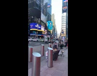 Guy hangs onto back of uhaul truck 