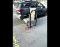 Collab winy - Chair tied to railings with bike lock