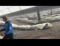 Guy wearing red helmet jumps on dirt bike 