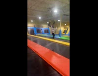 Girl does backflips on trampoline and falls