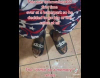 Guy shows friends shoes he brought to waterpark 