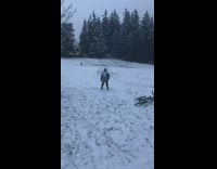 Skier pushed by giant backpack fan in the snow