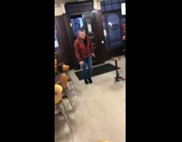 Two guys somersaulting in bar run into each other