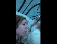 Cat licking girls nose and face in bed wont stop