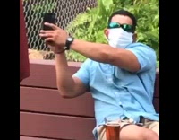 Blue shirt face mask guy restaurant patio 