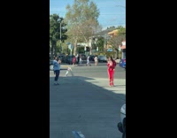 Girl dances alone red outfit shoes 