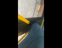 Guy recording his foot stuck outside the door on a moving bus