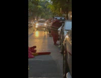 Guy performs with red jumpsuit 