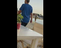 Woman yellow top tiktok dance beach sunset