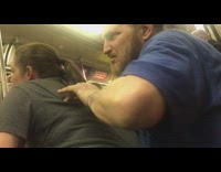 Man massages woman in grey shirt slaps her at the end