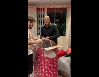Man opens giant present full of boxes