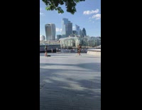 Two guys black shirt walk act park