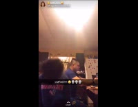 Girl dances to trap remix Barney song, slips on kitchen floor