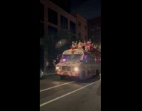 Collab WINY - Barbie themed party bus with people on roof