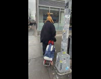 A guy wears a hat with a moving reindeer