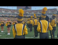 Marching band POV in the middle of the football stadium