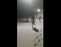 Two guys running naked in the snow 