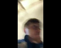 Guy crawling under car drags face across balls tow hitch