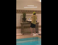Guy yellow cap shirt dance indoor pool