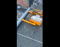 Pedestrian signal pole light fell on street