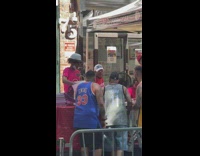 spike Lee with people under tents 