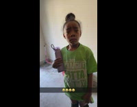 Little girl dances while frowning 