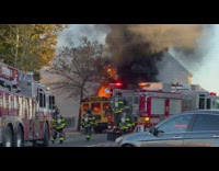 City on fire ambulance and fire fighter on street NYC 
