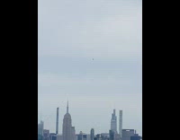 Person with parachute land middle of the city