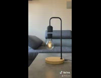 Guy turns light off magnetic lightbulb lamp