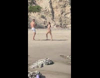 Woman leopard print bikini strut beach laugh