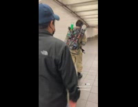 Guy ghostbusters halloween costume backpack subway station
