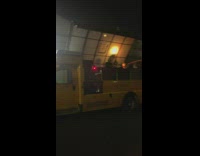 Small yellow school bus converted to dj booth