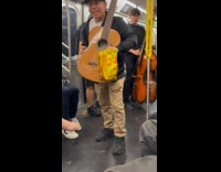 Band perform in train guitarist collect tips